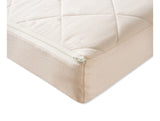 Organic-kids-mattress-closeup-of-quilted-cotton-cover-with-zipper-in-Ivory-color-made-by-NaturalMat-sold-by-Huckleberry-Kids-Rooms
