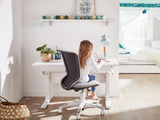 Kids desk chair in grey with girl sitting at desk - Huckleberry Kids Rooms